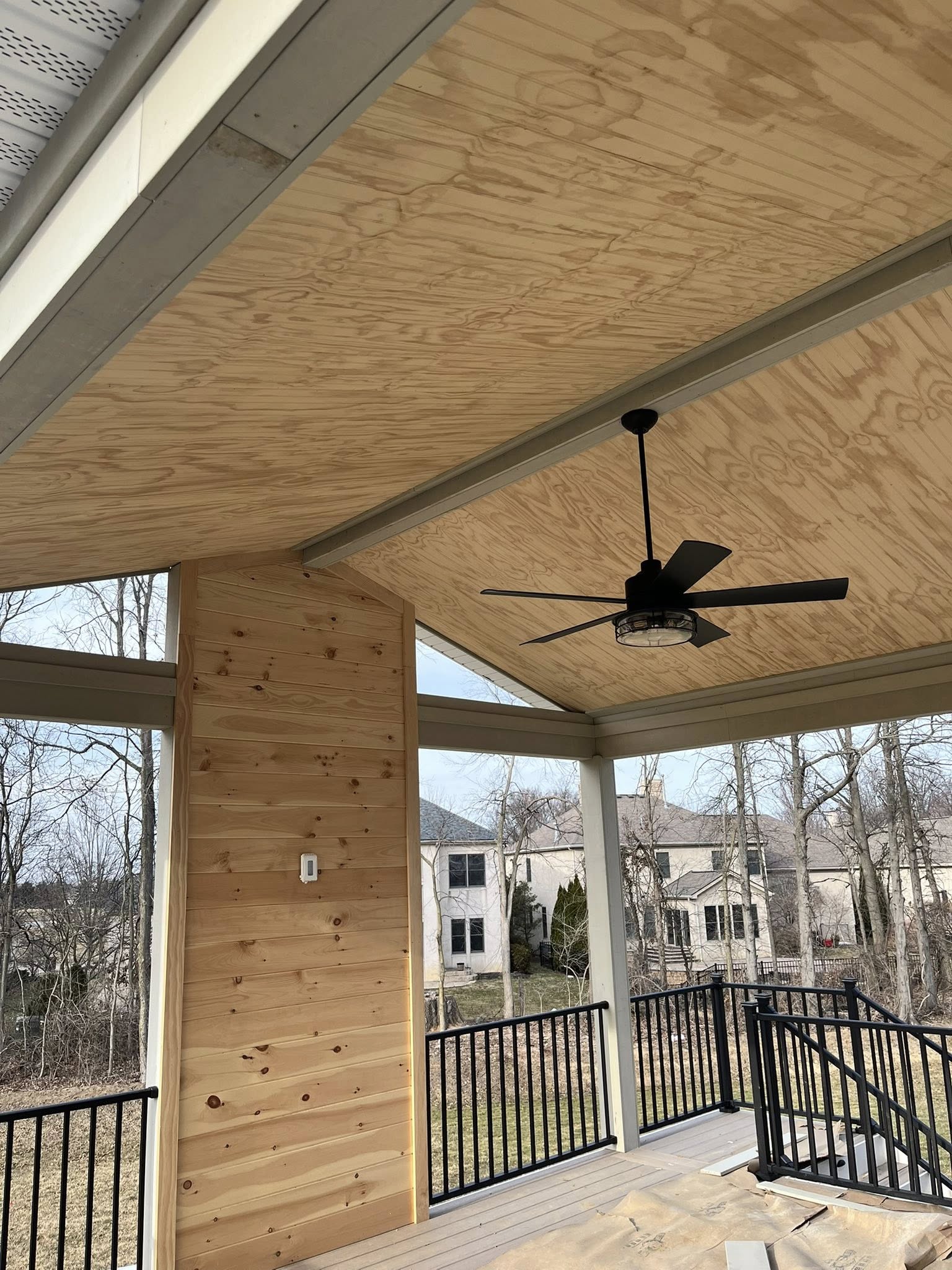 Porch with natural cedar plank ceiling accent and ceiling fan
